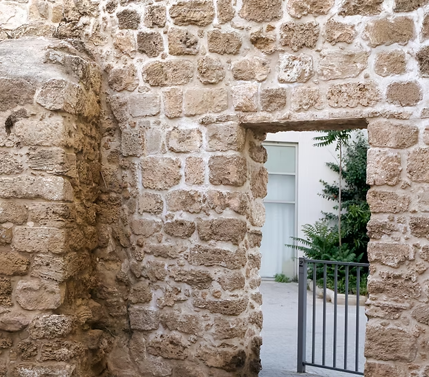 Restored stone wall and doorway on a period property